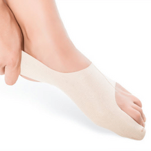 Load image into Gallery viewer, Beige bunion corrector being worn on a foot against a white background
